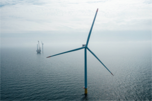 Large offshore wind turbine in the Baltic Sea with an installation vessel operating in the background