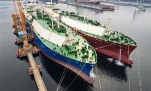 Hanwha Ocean LNG carriers conducting ship-to-ship transfer during sea trials off Geoje Island Description: