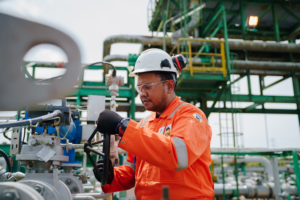 Eni and PETRONAS executives at ADIPEC 2025 signing upstream joint venture