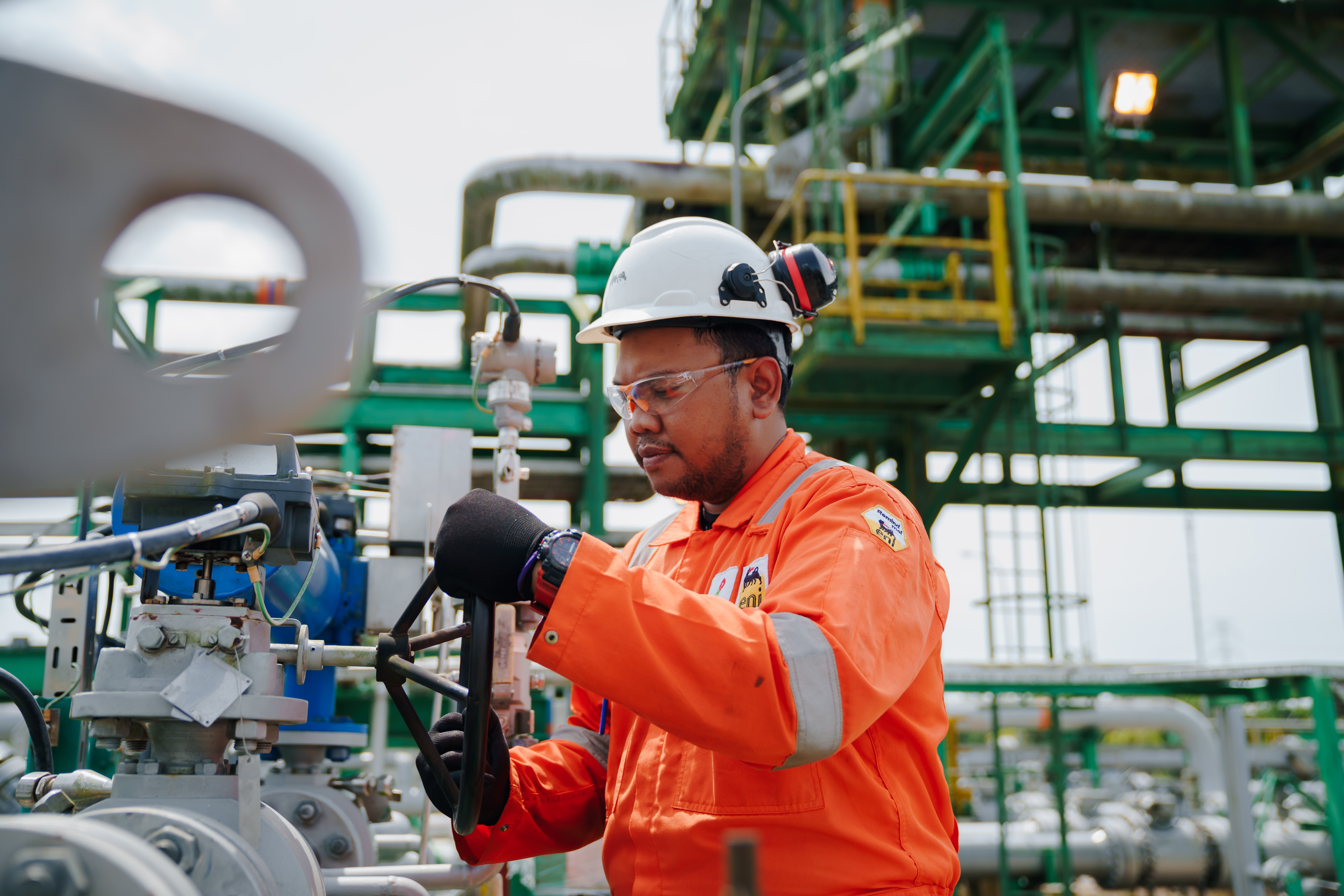 Eni and PETRONAS executives at ADIPEC 2025 signing upstream joint venture