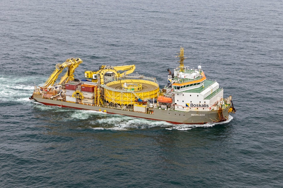 Boskalis Ndurance installing inter-array cables for a French offshore wind farm after loading cables in Greece